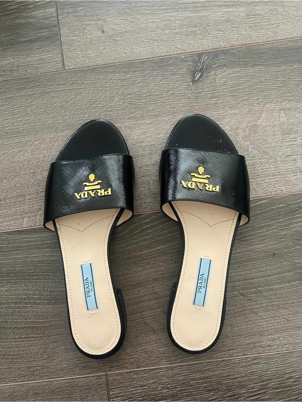 Prada Black Leather Slide Mules with Gold Logo